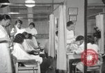 Immagine di Salone di bellezza per donne afroamericane ad Harlem New York City USA, 1940, secondo 18 filmato di repertorio 65675063284