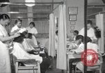 Immagine di Salone di bellezza per donne afroamericane ad Harlem New York City USA, 1940, secondo 19 filmato di repertorio 65675063284