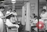 Immagine di Salone di bellezza per donne afroamericane ad Harlem New York City USA, 1940, secondo 20 filmato di repertorio 65675063284