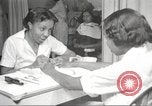 Immagine di Salone di bellezza per donne afroamericane ad Harlem New York City USA, 1940, secondo 22 filmato di repertorio 65675063284
