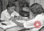 Immagine di Salone di bellezza per donne afroamericane ad Harlem New York City USA, 1940, secondo 23 filmato di repertorio 65675063284