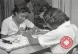Immagine di Salone di bellezza per donne afroamericane ad Harlem New York City USA, 1940, secondo 24 filmato di repertorio 65675063284