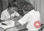 Immagine di Salone di bellezza per donne afroamericane ad Harlem New York City USA, 1940, secondo 25 filmato di repertorio 65675063284