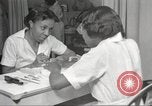 Immagine di Salone di bellezza per donne afroamericane ad Harlem New York City USA, 1940, secondo 26 filmato di repertorio 65675063284