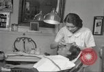 Immagine di Salone di bellezza per donne afroamericane ad Harlem New York City USA, 1940, secondo 31 filmato di repertorio 65675063284