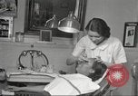 Immagine di Salone di bellezza per donne afroamericane ad Harlem New York City USA, 1940, secondo 32 filmato di repertorio 65675063284