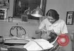Immagine di Salone di bellezza per donne afroamericane ad Harlem New York City USA, 1940, secondo 33 filmato di repertorio 65675063284