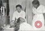 Immagine di Salone di bellezza per donne afroamericane ad Harlem New York City USA, 1940, secondo 47 filmato di repertorio 65675063284