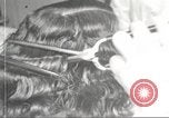Immagine di Salone di bellezza per donne afroamericane ad Harlem New York City USA, 1940, secondo 62 filmato di repertorio 65675063284
