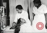 Immagine di Salone di bellezza dell'Associazione cristiana delle giovani Donne Harlem New York City USA, 1940, secondo 47 filmato di repertorio 65675063300