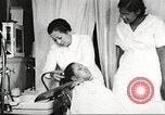 Immagine di Salone di bellezza dell'Associazione cristiana delle giovani Donne Harlem New York City USA, 1940, secondo 48 filmato di repertorio 65675063300
