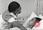 Immagine di Per donna giovane Associazione Cristiana Harlem New York City USA, 1940, secondo 14 filmato di repertorio 65675063304