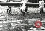 Image of Scenes from an annual Harvard and Yale rowing race on the Thames River New London Connecticut USA, 1900, second 16 stock footage video 65675063384