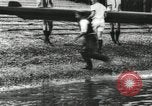 Image of Scenes from an annual Harvard and Yale rowing race on the Thames River New London Connecticut USA, 1900, second 17 stock footage video 65675063384