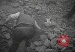 Image of search for survivors after Spanish Civil War bomb attack Spain, 1936, second 20 stock footage video 65675063415