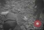 Image of search for survivors after Spanish Civil War bomb attack Spain, 1936, second 23 stock footage video 65675063415