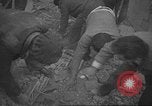 Image of search for survivors after Spanish Civil War bomb attack Spain, 1936, second 25 stock footage video 65675063415