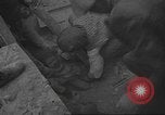 Image of search for survivors after Spanish Civil War bomb attack Spain, 1936, second 33 stock footage video 65675063415