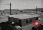 Image of Operation Cue effects on house and telephone poles Nevada United States USA, 1955, second 1 stock footage video 65675063885