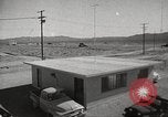 Image of Operation Cue effects on house and telephone poles Nevada United States USA, 1955, second 5 stock footage video 65675063885