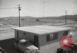 Image of Operation Cue effects on house and telephone poles Nevada United States USA, 1955, second 8 stock footage video 65675063885
