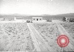 Image of House and cars in Operation Cue nuclear test Nevada United States USA, 1955, second 1 stock footage video 65675063891