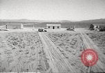 Image of House and cars in Operation Cue nuclear test Nevada United States USA, 1955, second 3 stock footage video 65675063891