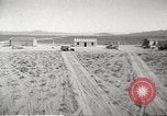 Image of House and cars in Operation Cue nuclear test Nevada United States USA, 1955, second 4 stock footage video 65675063891