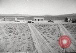 Image of House and cars in Operation Cue nuclear test Nevada United States USA, 1955, second 6 stock footage video 65675063891