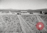 Image of House and cars in Operation Cue nuclear test Nevada United States USA, 1955, second 7 stock footage video 65675063891