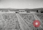 Image of House and cars in Operation Cue nuclear test Nevada United States USA, 1955, second 9 stock footage video 65675063891