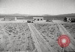 Image of House and cars in Operation Cue nuclear test Nevada United States USA, 1955, second 10 stock footage video 65675063891