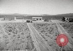 Image of House and cars in Operation Cue nuclear test Nevada United States USA, 1955, second 11 stock footage video 65675063891