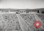 Image of House and cars in Operation Cue nuclear test Nevada United States USA, 1955, second 12 stock footage video 65675063891