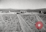 Image of House and cars in Operation Cue nuclear test Nevada United States USA, 1955, second 18 stock footage video 65675063891
