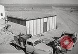 Image of Operation Cue nuclear testing staff and test house  Nevada United States USA, 1955, second 4 stock footage video 65675063895