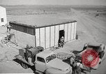 Image of Operation Cue nuclear testing staff and test house  Nevada United States USA, 1955, second 7 stock footage video 65675063895