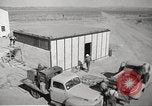 Image of Operation Cue nuclear testing staff and test house  Nevada United States USA, 1955, second 8 stock footage video 65675063895