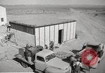 Image of Operation Cue nuclear testing staff and test house  Nevada United States USA, 1955, second 10 stock footage video 65675063895