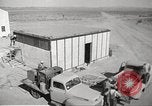 Image of Operation Cue nuclear testing staff and test house  Nevada United States USA, 1955, second 13 stock footage video 65675063895