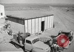 Image of Operation Cue nuclear testing staff and test house  Nevada United States USA, 1955, second 16 stock footage video 65675063895