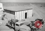 Image of Operation Cue nuclear testing staff and test house  Nevada United States USA, 1955, second 18 stock footage video 65675063895