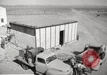Image of Operation Cue nuclear testing staff and test house  Nevada United States USA, 1955, second 19 stock footage video 65675063895
