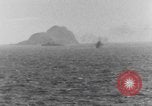 Image of US Warships fire guns at Corregidor Philippines, 1945, second 13 stock footage video 65675063916