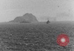 Image of US Warships fire guns at Corregidor Philippines, 1945, second 15 stock footage video 65675063916