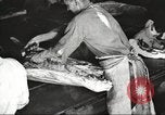 Image of workers in butchery United States USA, 1919, second 21 stock footage video 65675063928