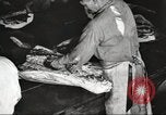 Image of workers in butchery United States USA, 1919, second 22 stock footage video 65675063928