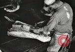 Image of workers in butchery United States USA, 1919, second 23 stock footage video 65675063928