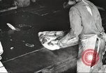 Image of workers in butchery United States USA, 1919, second 28 stock footage video 65675063928