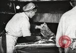Image of workers in butchery United States USA, 1919, second 36 stock footage video 65675063928
